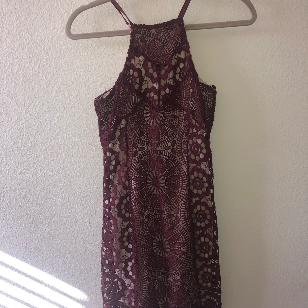 Beige dress with maroon lace over it
